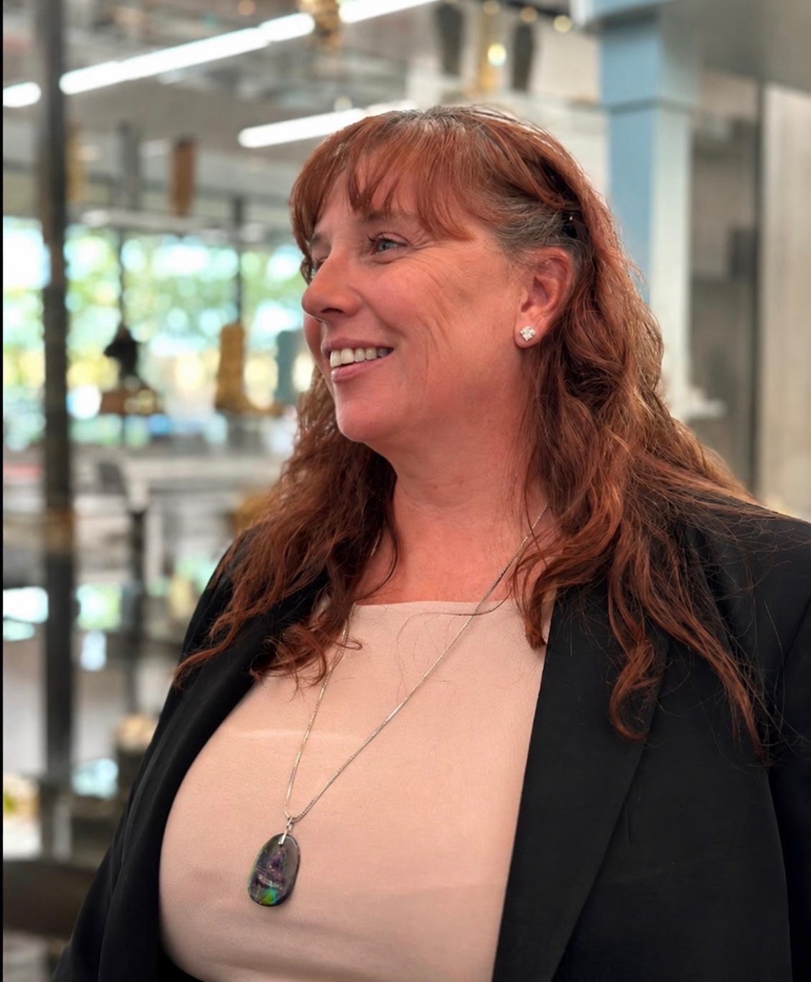 Lynea Vaugeois Hetherington, Co-Founder and President of Revive by Design, in a professional corporate setting